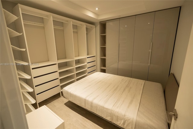45 SW 9th St Unit 1705, Miami, FL 33130 - unfurnished bedroom with wood finished floors and recessed lighting