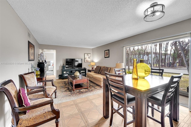 470 N Laurel Dr Unit 3A, Margate, FL 33063 - dining area with a textured ceiling