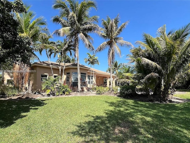 3230 SW 139th Ter, Davie, FL 33330 - view of front facade featuring a front yard and stucco siding