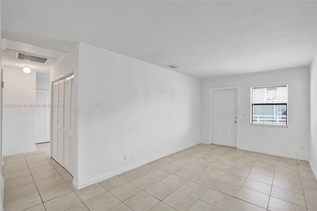1200 W 31st St, Riviera Beach, FL 33404 - unfurnished room featuring light tile patterned floors and baseboards