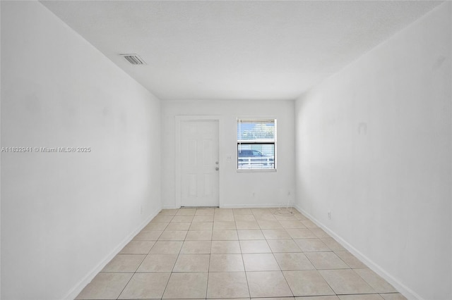 1200 W 31st St, Riviera Beach, FL 33404 - unfurnished room featuring baseboards and light tile patterned floors
