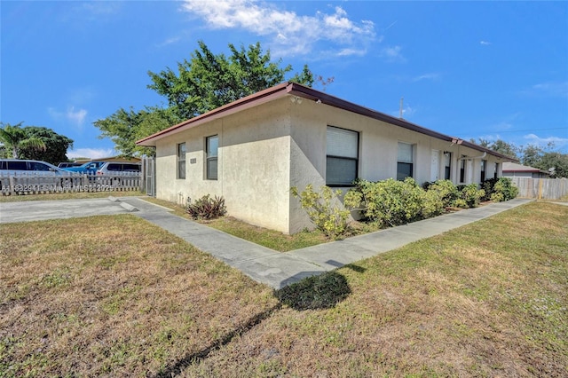 1200 W 31st St, Riviera Beach, FL 33404 - view of side of property with stucco siding