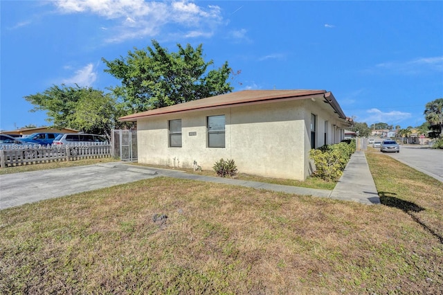 1200 W 31st St, Riviera Beach, FL 33404 - view of home's exterior featuring stucco siding