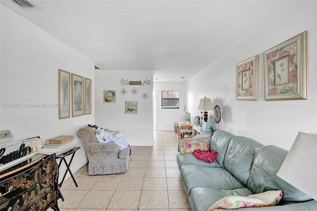 1200 W 31st St, Riviera Beach, FL 33404 - living area with a textured ceiling and light tile patterned flooring