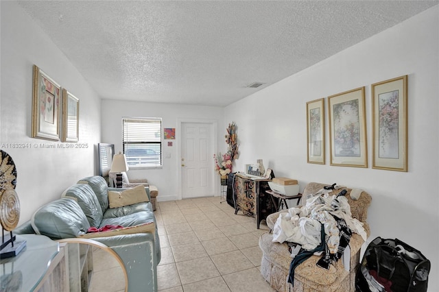 1200 W 31st St, Riviera Beach, FL 33404 - living room featuring a textured ceiling and light tile patterned floors