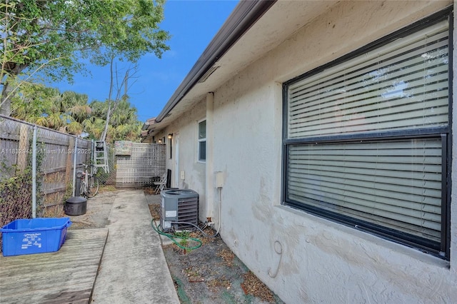 1200 W 31st St, Riviera Beach, FL 33404 - view of property exterior with stucco siding and a central air condition unit