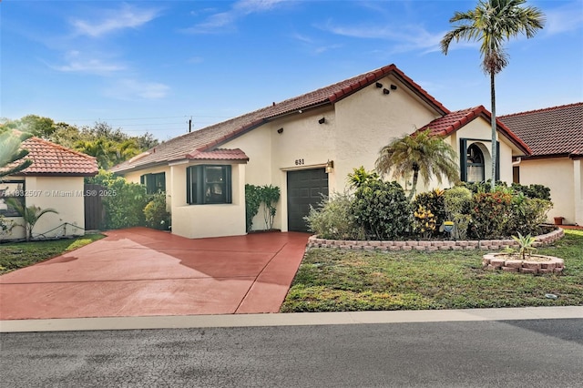 631 SW 113th Ave, Pembroke Pines, FL 33025 - mediterranean / spanish home with concrete driveway, stucco siding, a tile roof, and an attached garage