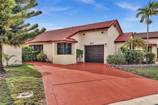 631 SW 113th Ave, Pembroke Pines, FL 33025 - mediterranean / spanish-style home featuring a tile roof, a garage, driveway, and stucco siding