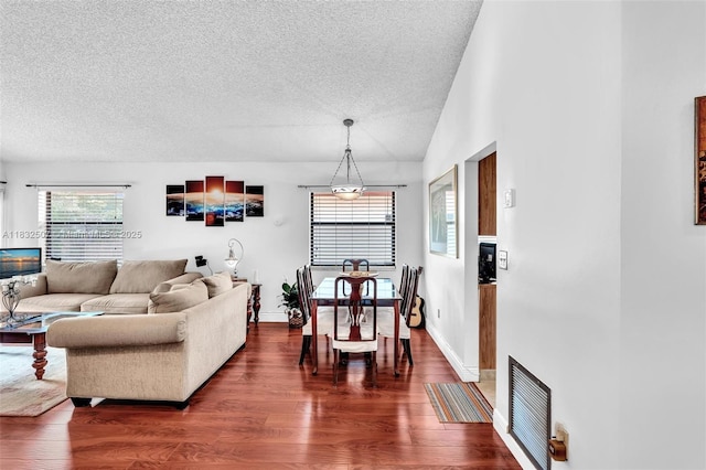 631 SW 113th Ave, Pembroke Pines, FL 33025 - living room featuring a textured ceiling, dark wood-type flooring, and vaulted ceiling