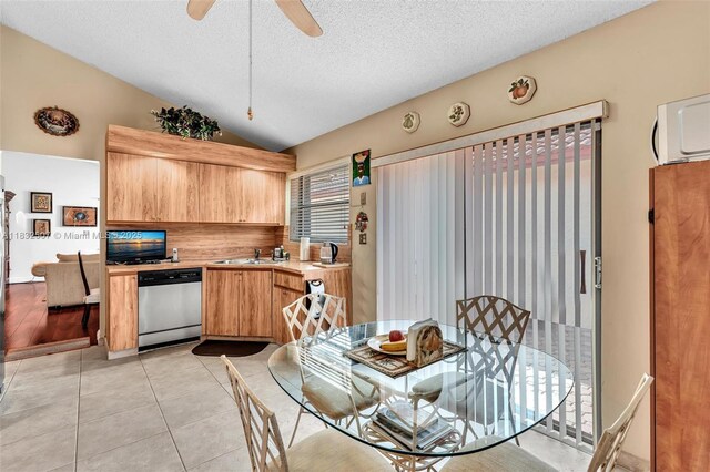 631 SW 113th Ave, Pembroke Pines, FL 33025 - dining room with vaulted ceiling, a textured ceiling, a ceiling fan, light tile patterned floors, and a wall unit AC