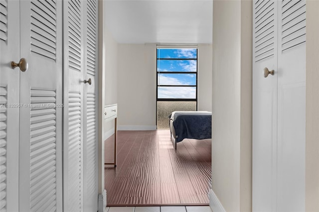 2500 NE 135th St Unit C711, North Miami, FL 33181 - corridor with baseboards and wood finished floors