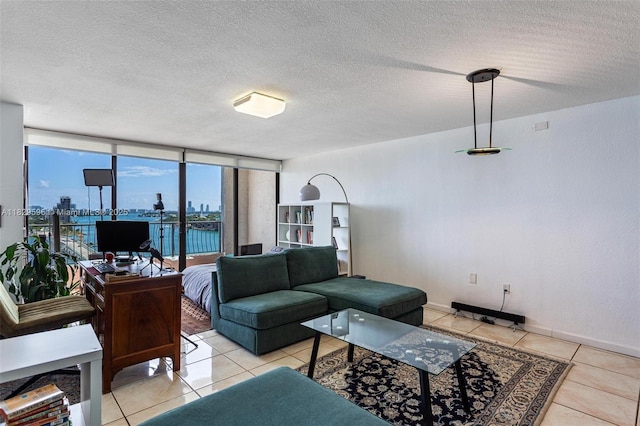 555 NE 15th St Unit 15B, Miami, FL 33132 - living area featuring light tile patterned floors, a textured ceiling, and expansive windows