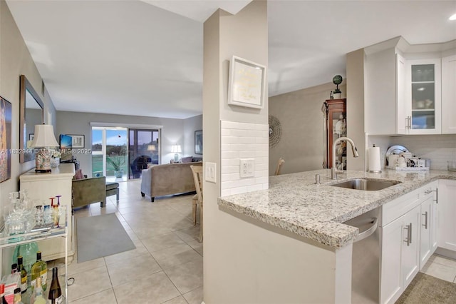 800 SW 125th Way Unit 405O, Pembroke Pines, FL 33027 - kitchen featuring dishwasher, light stone counters, open floor plan, and white cabinets