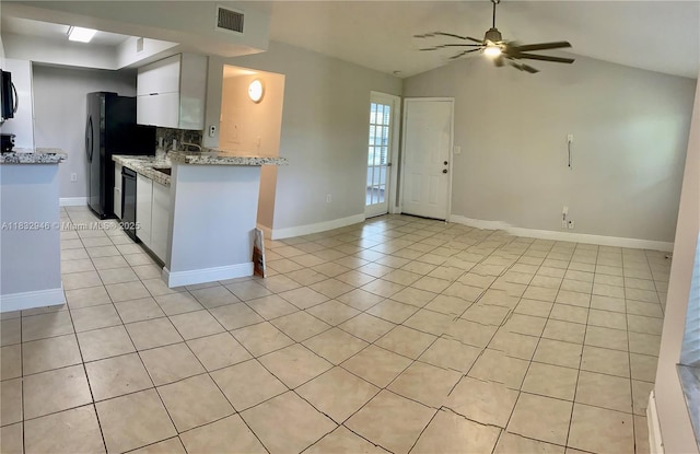 15661 SW 104th Ter Unit 3112, Miami, FL 33196 - kitchen featuring light tile patterned floors, open floor plan, white cabinetry, ceiling fan, and lofted ceiling