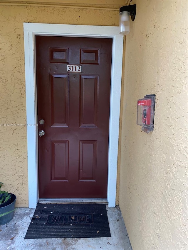 15661 SW 104th Ter Unit 3112, Miami, FL 33196 - doorway to property with stucco siding