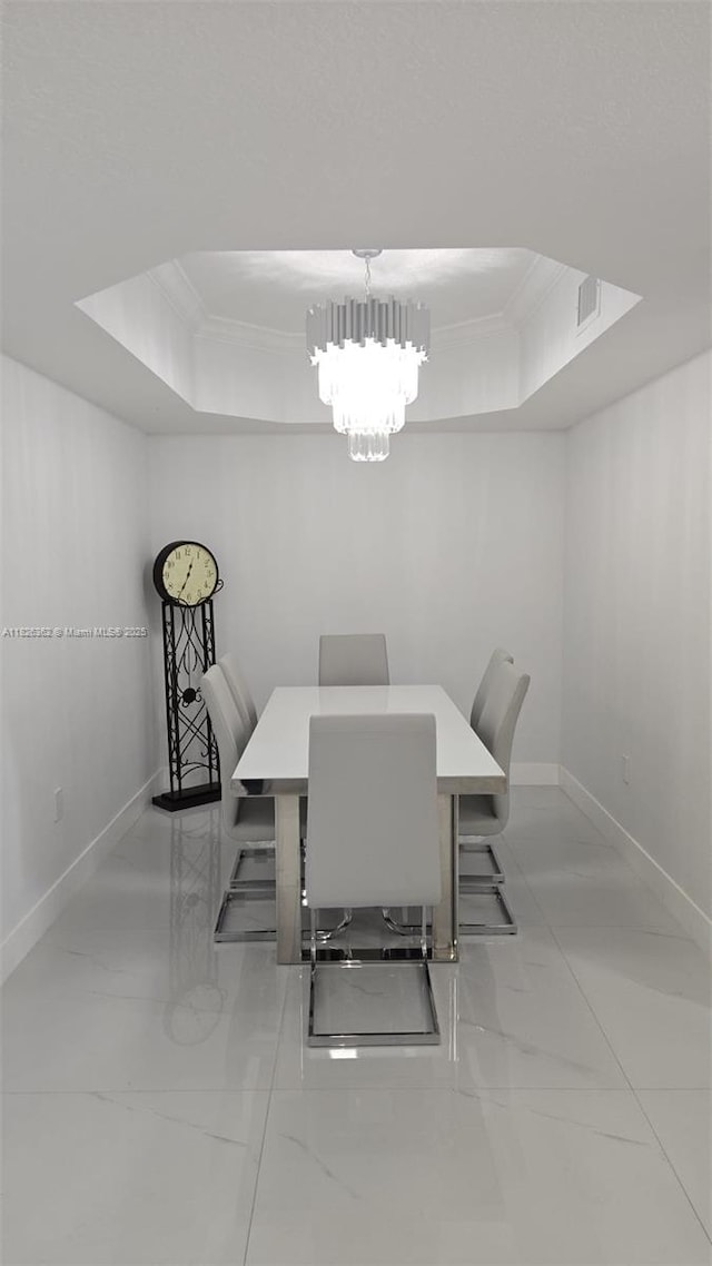 230 SW 117th Ter, Pembroke Pines, FL 33025 - dining area featuring a raised ceiling, marble finish floors, crown molding, and a chandelier