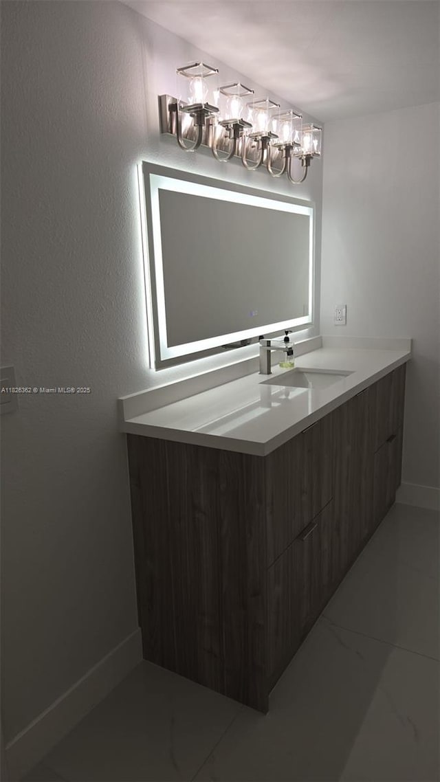 230 SW 117th Ter, Pembroke Pines, FL 33025 - bathroom featuring vanity, a chandelier, and marble look tiles