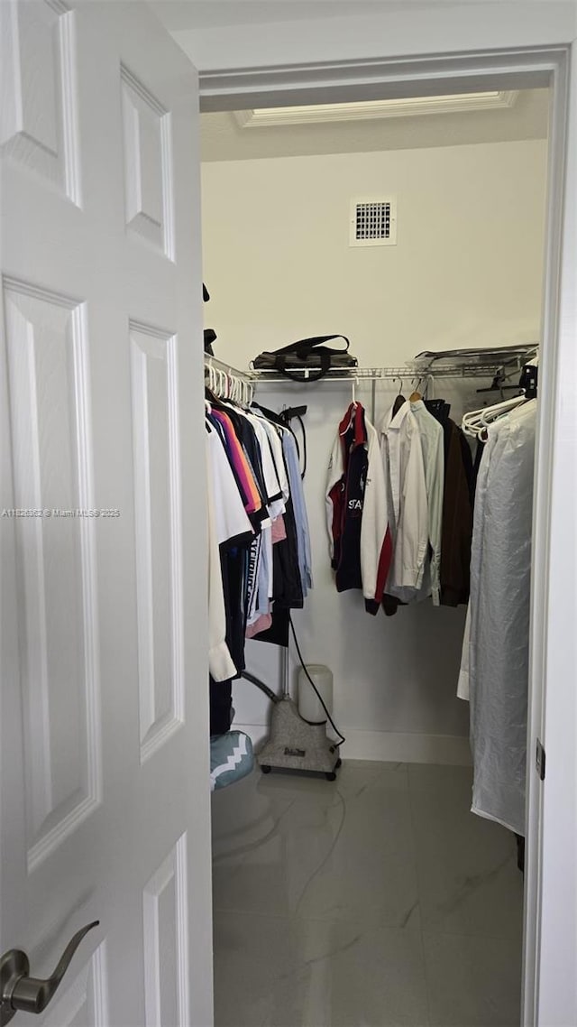 230 SW 117th Ter, Pembroke Pines, FL 33025 - spacious closet featuring marble look tiles