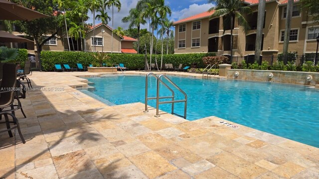 230 SW 117th Ter, Pembroke Pines, FL 33025 - community pool featuring a patio area