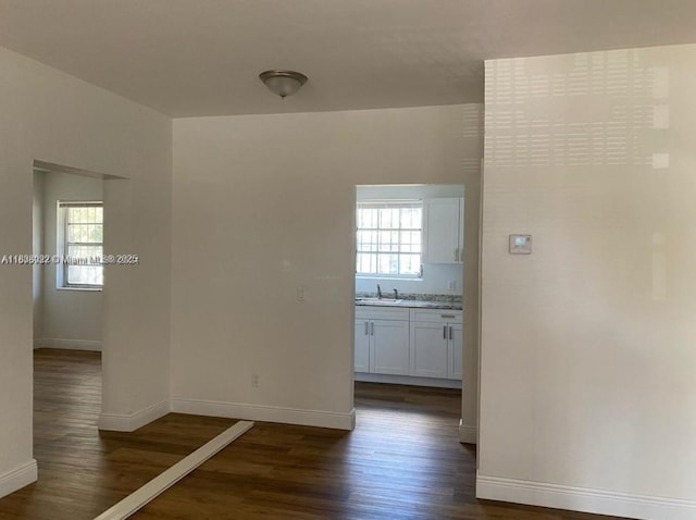 791 E 22nd St, Hialeah, FL 33013 - corridor featuring dark wood-style flooring