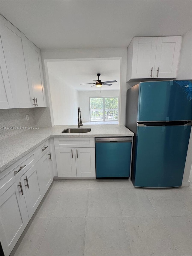 7915 Camino Real Unit N-302, Miami, FL 33143 - kitchen with dishwasher, freestanding refrigerator, white cabinets, ceiling fan, and light tile patterned floors