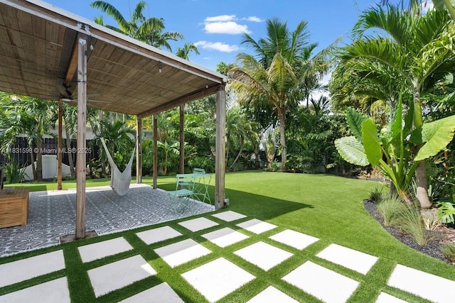 631 NE 87th St, Miami, FL 33138 - view of green lawn with a patio area