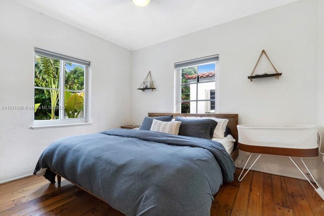 631 NE 87th St, Miami, FL 33138 - bedroom featuring wood-type flooring and baseboards