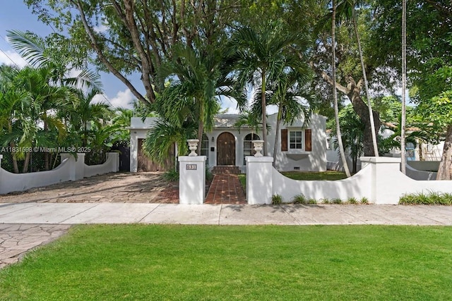 631 NE 87th St, Miami, FL 33138 - view of front of home featuring a fenced front yard and stucco siding