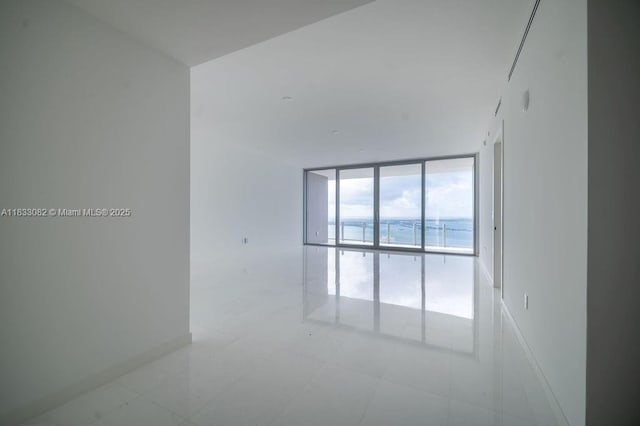 300 Biscayne Blvd Way Unit 4603, Miami, FL 33131 - spare room featuring floor to ceiling windows and baseboards