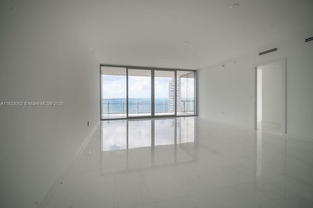 300 Biscayne Blvd Way Unit 4603, Miami, FL 33131 - empty room featuring a wall of windows and a water view