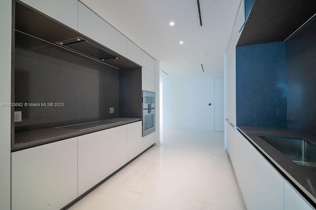 300 Biscayne Blvd Way Unit 4603, Miami, FL 33131 - kitchen featuring modern cabinets, white cabinets, black electric cooktop, dark countertops, and recessed lighting