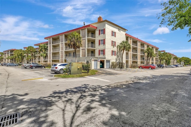 3070 NW 48th Ter Unit 415, Lauderdale Lakes, FL 33313 - view of apartment building / complex featuring uncovered parking