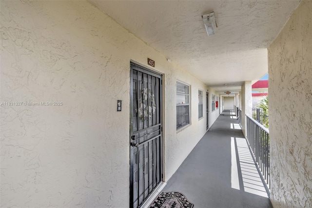 3070 NW 48th Ter Unit 415, Lauderdale Lakes, FL 33313 - property entrance with stucco siding and a balcony