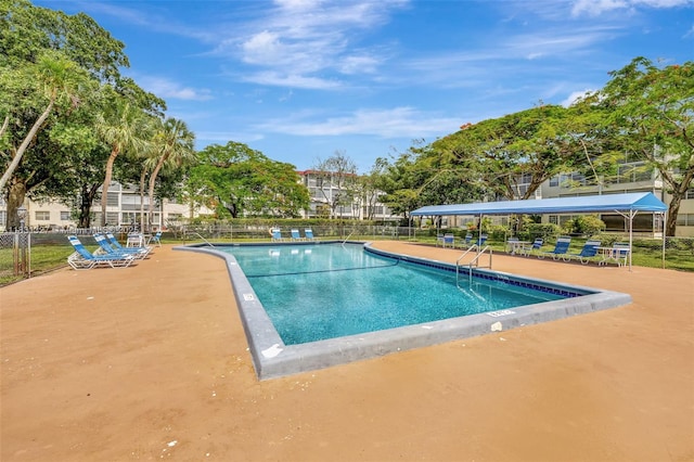 3070 NW 48th Ter Unit 415, Lauderdale Lakes, FL 33313 - community pool featuring a patio