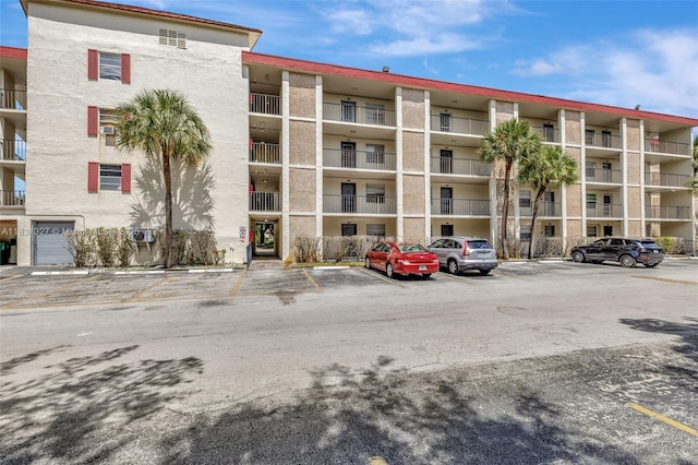 3070 NW 48th Ter Unit 415, Lauderdale Lakes, FL 33313 - view of apartment building / complex with uncovered parking