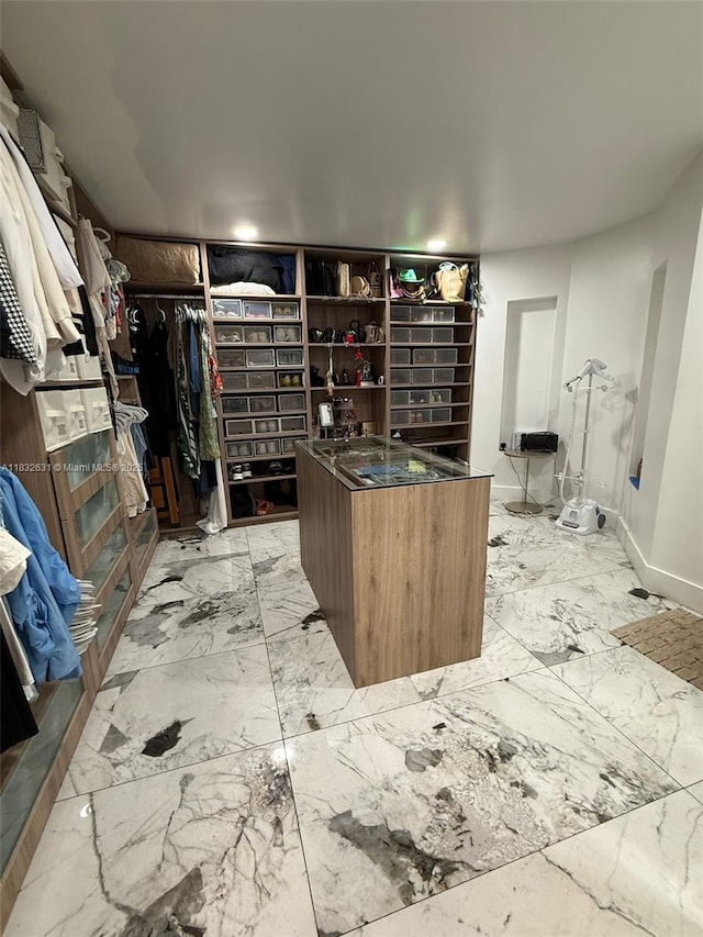 5838 Madison St, Hollywood, FL 33023 - walk in closet featuring light marble finish floors