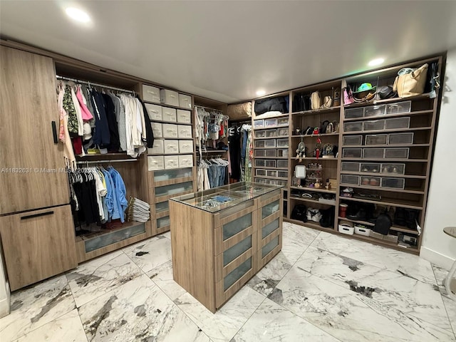 5838 Madison St, Hollywood, FL 33023 - walk in closet featuring light marble finish floors
