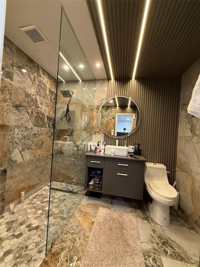 5838 Madison St, Hollywood, FL 33023 - bathroom with walk in shower, vanity, tile walls, and marble finish floors