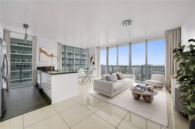 1111 SW 1st Ave Unit 2914-N, Miami, FL 33130 - living area featuring floor to ceiling windows and dark tile patterned flooring