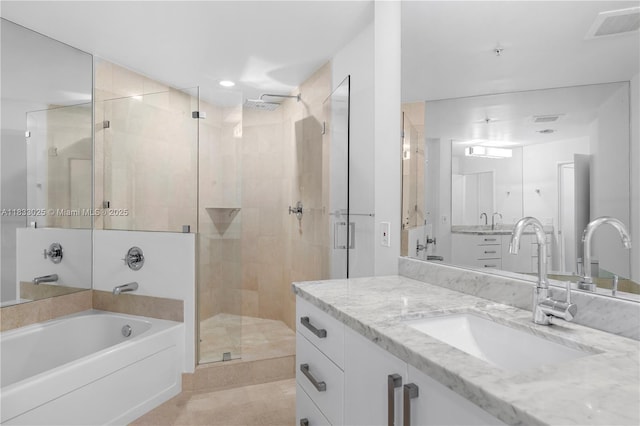 1111 SW 1st Ave Unit 2914-N, Miami, FL 33130 - full bath featuring a shower stall, a garden tub, vanity, and tile patterned floors