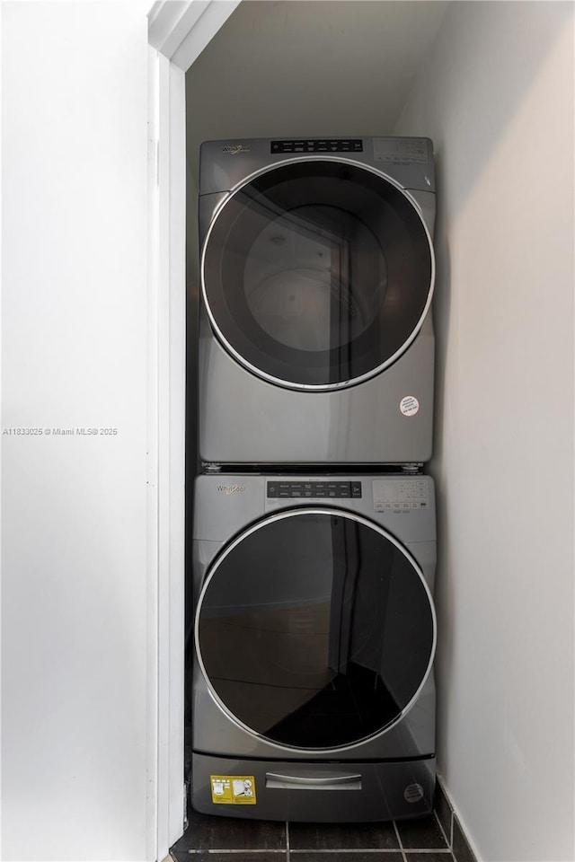 1111 SW 1st Ave Unit 2914-N, Miami, FL 33130 - laundry area with stacked washer and clothes dryer and tile patterned floors