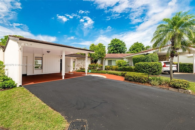8445 SW 80th Pl, Miami, FL 33143 - view of front facade featuring a carport and driveway