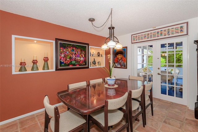 8445 SW 80th Pl, Miami, FL 33143 - dining area featuring a textured ceiling and french doors