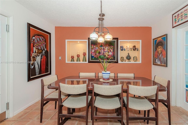 8445 SW 80th Pl, Miami, FL 33143 - dining area featuring a textured ceiling