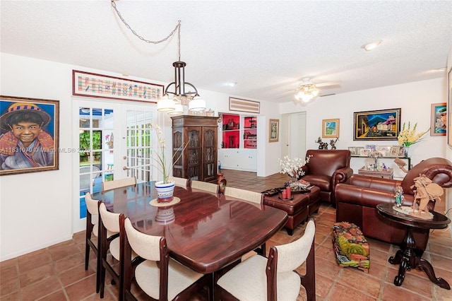 8445 SW 80th Pl, Miami, FL 33143 - tiled dining room featuring a textured ceiling, ceiling fan, and french doors