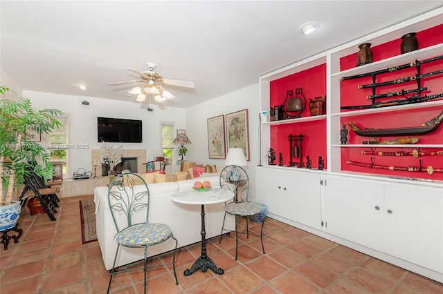 8445 SW 80th Pl, Miami, FL 33143 - dining room with ceiling fan, a fireplace, and healthy amount of natural light