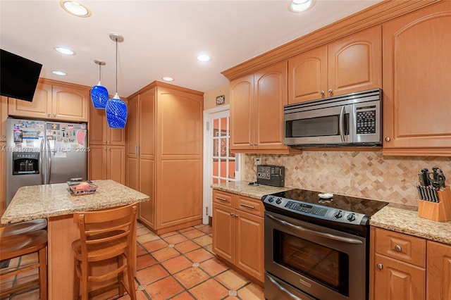 8445 SW 80th Pl, Miami, FL 33143 - kitchen with stainless steel appliances, backsplash, light stone countertops, light tile patterned floors, and hanging light fixtures
