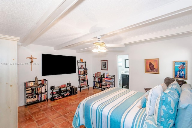 8445 SW 80th Pl, Miami, FL 33143 - bedroom featuring beamed ceiling, light tile patterned floors, a textured ceiling, ceiling fan, and ensuite bathroom