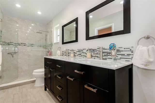 8445 SW 80th Pl, Miami, FL 33143 - full bath with a stall shower, double vanity, backsplash, wood finished floors, and recessed lighting