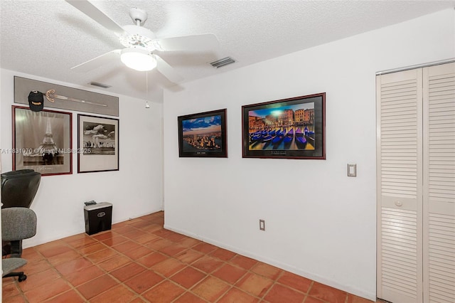 8445 SW 80th Pl, Miami, FL 33143 - tiled home office with ceiling fan and a textured ceiling